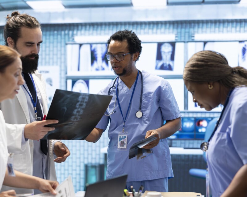physicians-radiologists-examine-x-ray-scan-results-develop-treatment-plan